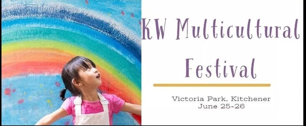 KW Multicultural Festival | Victoria Park, Kitchener | June 25-26 (2022) (image of a young girl with her back to a multi-coloured rainbow murual looking up in amazement)