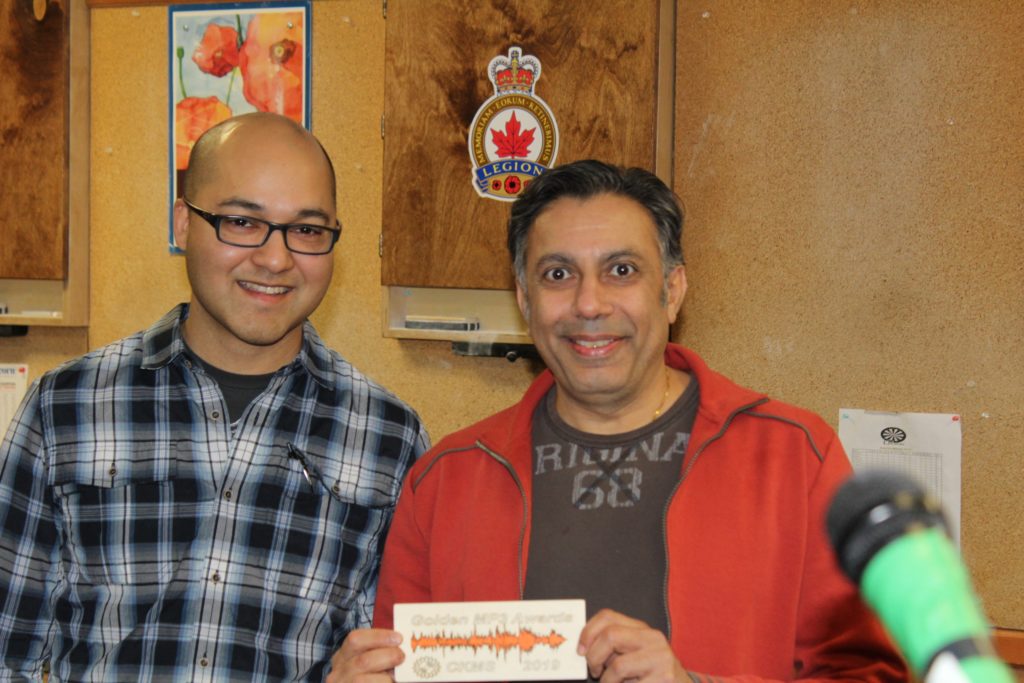 Nat Persaud with Vin Maru holding his Golden MP3 Award plaque