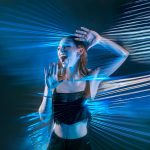 (a woman with her hands against a wall wall of plastic wrap, blue lighting)