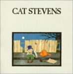Cat Stevens (text above an illustration of a young boy wearing a top hat, beside an orange cat, both sitting on the edge of a sidewalk in front of a broken fence with an old tree on the right, and the moon above the fence)