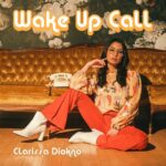 Wake Up Call | Clarissa Diokno (Clarissa sitting on the floor in front of a couch with a telephone on it)