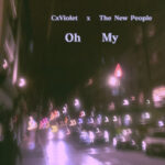 CxViolet & The New People | Oh My (a cityscape showing cars on a road with the headlights blurred by raindrops on the lens)