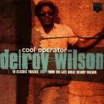 Cool Operator | Delroy Wilson | 19 Classic Tracks from the late great Delroy Wilson (photo of a man standing at a wall, colour saturated orange)