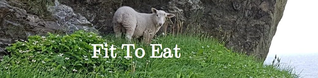 Fit To Eat (white letters over a picture of a cliff-side meadow with a sheep looking into the camera)