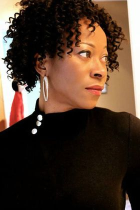 A profile headshot of Irene Ekweozoh