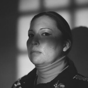 Black and white photo of Laura Niquay with her face in shadows