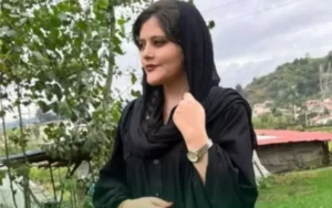 Mahsa Amini (woman wearing black clothes, including a hijab)