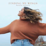 Finding My Wings | Natalia Valencia (Natalia with her face to the side, apparently spinning around, hair flying away)