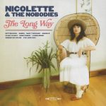 Nicolette and the Nobodies | The Long Way (a woman wearing a white dress and a straw hat sitting in a wicker chair beside a plant)
