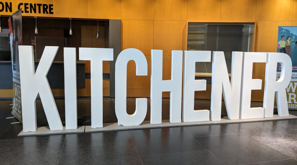 Large 3-feet tall letters spell out the word 'Kitchener' inside Kitchener city hall.