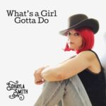 What's a Girl Gotta Do |  Sohayla Smith ( profile of Sohayla Smith sitting on the floor wearing a cowboy hat) 