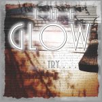 The Glow | Try (faded background of an old manuscript, lettering illegible)
