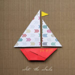 Set The Sails (a sailboat folded out of red construction paper with a sail folded out of  patterned paper, with a little yellow paper flag on the mast)