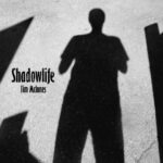 Shadowlife | Tim McInnes (photo of the shadow of a man cast on a concrete sidewalk)