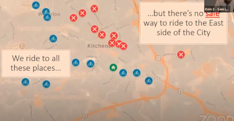 A map of Kitchener, with blue dots with tiny little cyclists in the middle representing where the presenter at the Kitchener city council meetings felt safe biking with their family, and red dots with an X to represent where they would like to be able to bike but found it unsafe. The blue dots are on the left side of the image and the red dots are on the right side